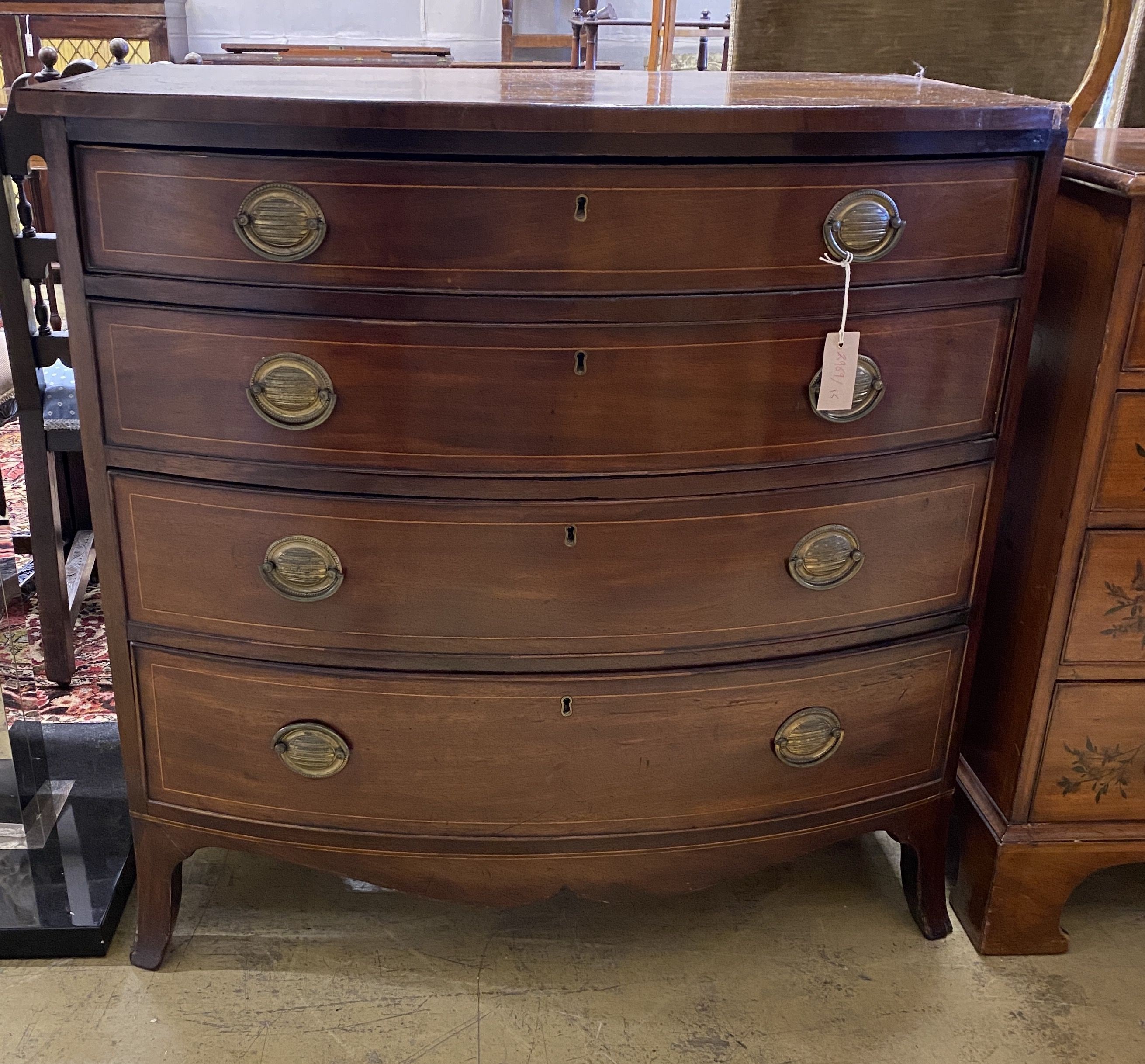 A Regency inlaid mahogany bow front chest of four drawers, width 92cm, depth 57cm, height 91cm